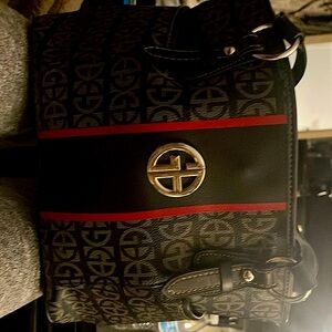 Classy purse, lightly used three separate sections inside plus smaller pockets